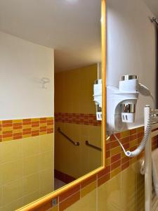 a bathroom with a mirror and a shower at Orange Lemon Center Palermo in Palermo