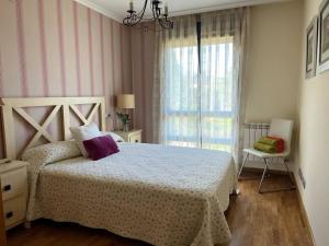 Postel nebo postele na pokoji v ubytování El Mirador del Orfanato