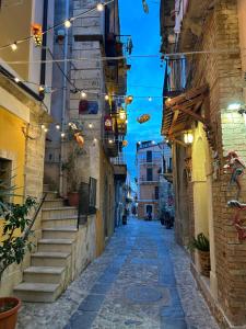an alley in an old town at night at B&B Casa CamiLory in San Lucido