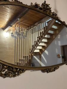 a reflection of a staircase in a mirror at B&B Casa CamiLory in San Lucido