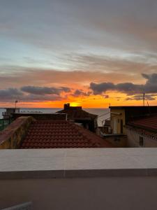 a view of the sunset from the roof of a building at B&B Casa CamiLory in San Lucido