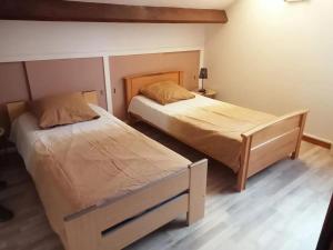 Katil atau katil-katil dalam bilik di Maison avec jardin à Vierzon