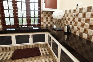 Kuchyň nebo kuchyňský kout v ubytování Jia Hill view rooms vagamon