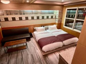 Krevet ili kreveti u jedinici u objektu 富士Outlet温泉Hotel