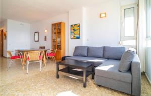 a living room with a couch and a table at Awesome Apartment In Málaga in Málaga