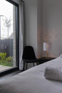 TY FOUR - Bel appartement T2 de standing vue mer客房内的一张或多张床位