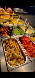 a buffet filled with different types of food in trays at St aubyn arms Hotel in Praze an Beeble