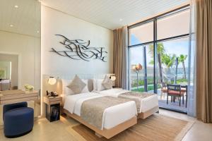 Postel nebo postele na pokoji v ubytování Bab Al Nojoum Hudayriyat Villas + 37 fotografií