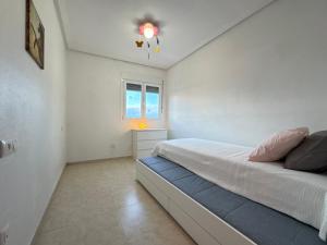 En eller flere senge i et værelse på Aloha