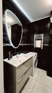 Kúpeľňa v ubytovaní Apartament Black-White