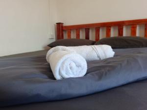 Postel nebo postele na pokoji v ubytování While away วายล์ อะเวย์
