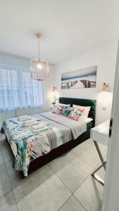 Postel nebo postele na pokoji v ubytování Apartament Yellow Mielno + 8 fotografií