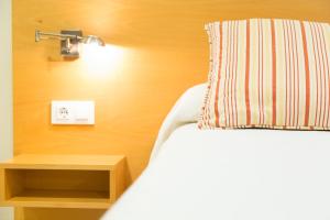 Posteľ alebo postele v izbe v ubytovaní Apartamentos Playa De Cóbreces