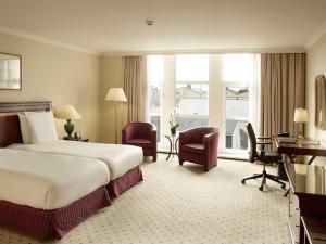 Ένα ή περισσότερα κρεβάτια σε δωμάτιο στο Hilton Antwerp Old Town