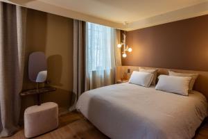 Postel nebo postele na pokoji v ubytování Yndo Hôtel