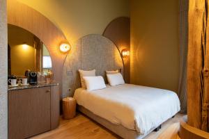 Postel nebo postele na pokoji v ubytování Yndo Hôtel