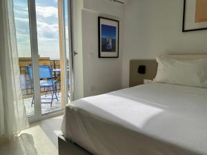 Ένα ή περισσότερα κρεβάτια σε δωμάτιο στο Palazzo Santa Maria