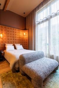 Postel nebo postele na pokoji v ubytování Yndo Hôtel