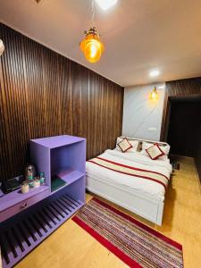 Ένα ή περισσότερα κρεβάτια σε δωμάτιο στο Hotel Amar