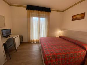 Postel nebo postele na pokoji v ubytování Hotel International