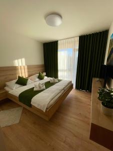 Posteľ alebo postele v izbe v ubytovaní DAPELOVA Apartments - Tále