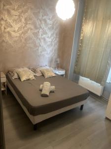 Postel nebo postele na pokoji v ubytování Appartement Familial PARIS PORTE LA VILETTE + 4 fotografie