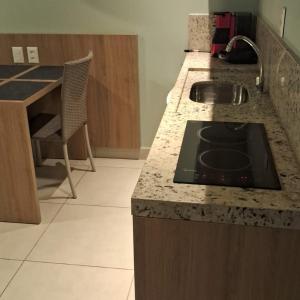 a kitchen with a counter top with a sink at BobZ Villas - Bora Bora 102 in Cajueiro