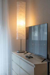 TV in/ali zabaviščno središče v nastanitvi Special PRIMERO PICASSO Apartment Basel, Bahnhof Grossbasel 10-STAR