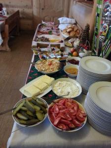 a buffet of food on a table with plates of food at U Hani w pobliżu Gorący Potok i Termy in Szaflary