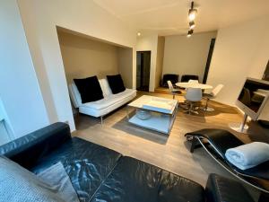 TV a/nebo společenská místnost v ubytování Les Dunes