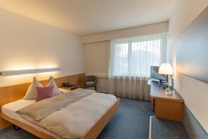 Voodi või voodid majutusasutuse Seeblick Höhenhotel toas