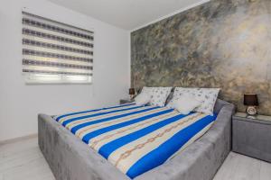 Posteľ alebo postele v izbe v ubytovaní Apartments Lucica