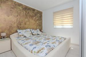 Posteľ alebo postele v izbe v ubytovaní Apartments Lucica