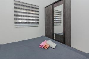 Posteľ alebo postele v izbe v ubytovaní Apartments Lucica