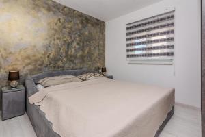 Posteľ alebo postele v izbe v ubytovaní Apartments Lucica