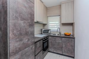 Kuchyňa alebo kuchynka v ubytovaní Apartments Lucica
