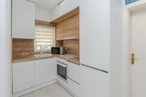 Kuchyňa alebo kuchynka v ubytovaní Apartments Lucica