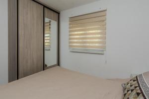 Posteľ alebo postele v izbe v ubytovaní Apartments Lucica