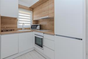 Kuchyňa alebo kuchynka v ubytovaní Apartments Lucica