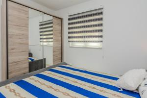 Posteľ alebo postele v izbe v ubytovaní Apartments Lucica