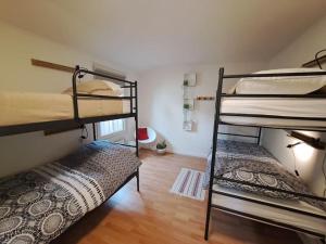 a room with two bunk beds and a floor at Villa Present - Chalet Heinkenszand VP008 in Heinkensand +35 photos