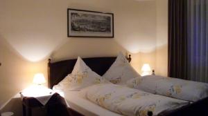 Postel nebo postele na pokoji v ubytování Hotel Mietz