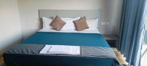 Voodi või voodid majutusasutuse Rock View Resort toas