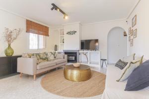 a living room with a couch and a coffee table at Casa El Sole in Mazarrón