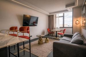 A television and/or entertainment centre at Poem Apartments, Las Canteras