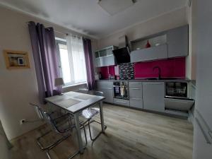 Kuchyňa alebo kuchynka v ubytovaní SAS Apartamenty Perfect + 5 fotografií