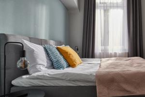 Postel nebo postele na pokoji v ubytování Butik Art Hotel