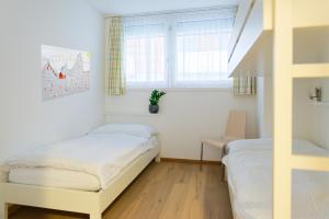 Postel nebo postele na pokoji v ubytování Apartment Topas + 7 fotografií