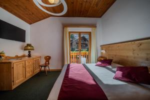 Postel nebo postele na pokoji v ubytování Hotel il Cardo