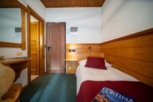 Postel nebo postele na pokoji v ubytování Hotel il Cardo
